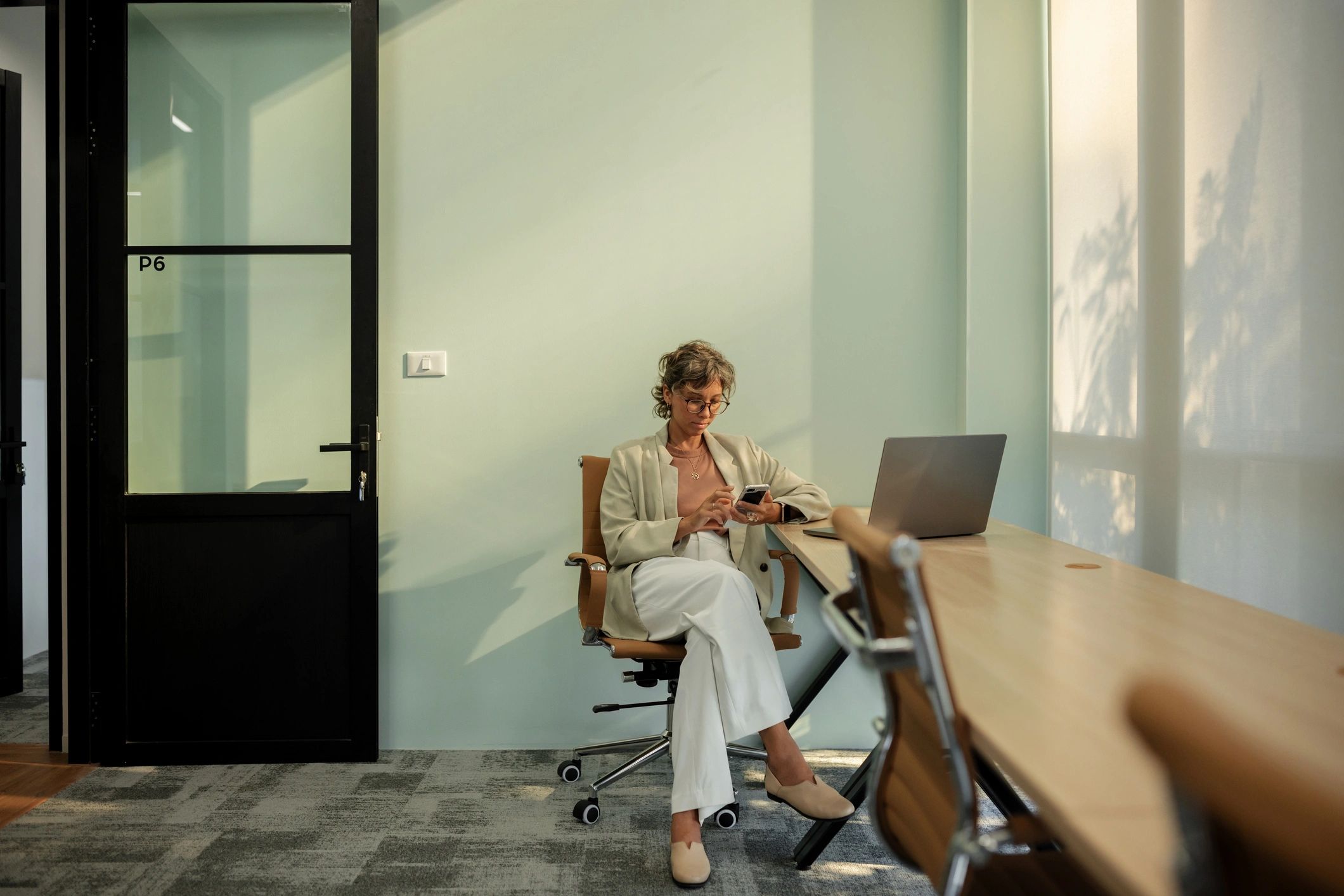 Professional cleaner in an office workspace